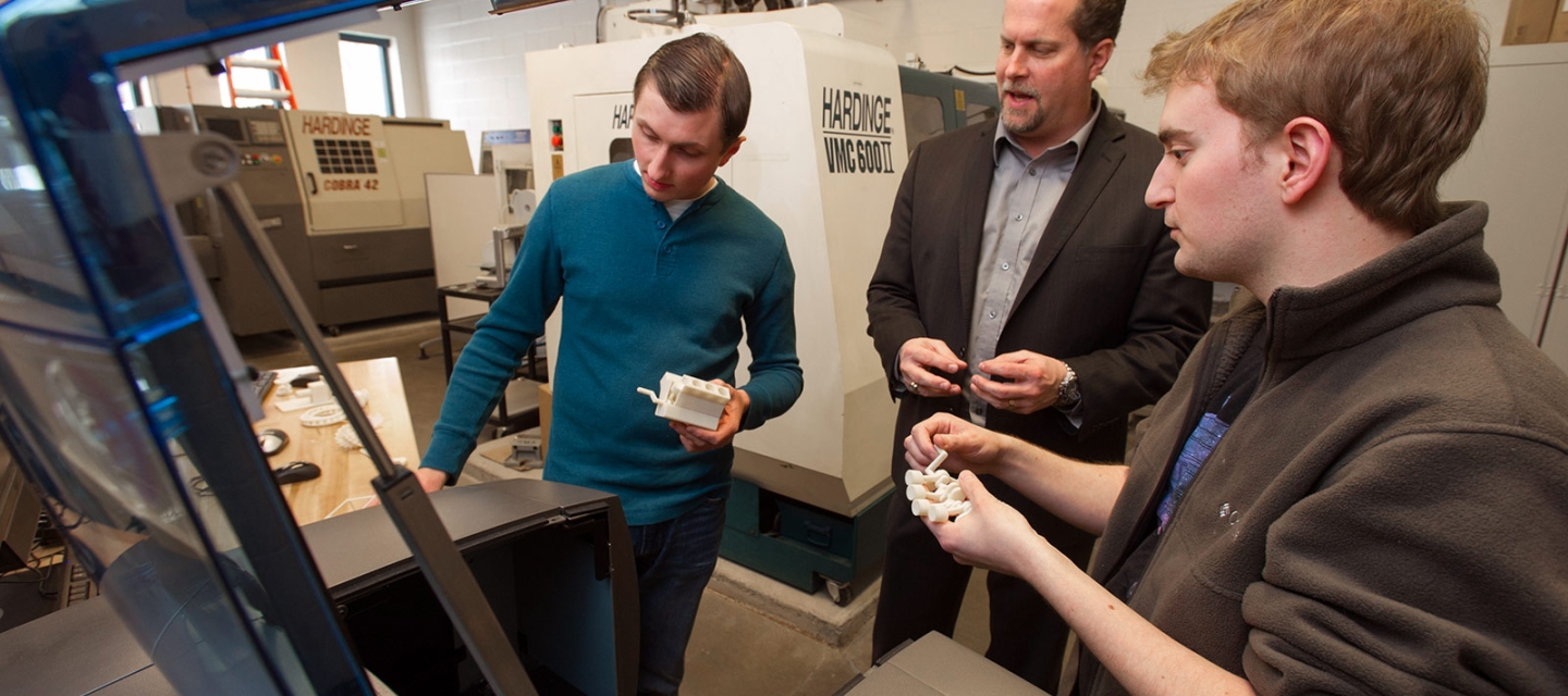 Students showing faculty member equipment